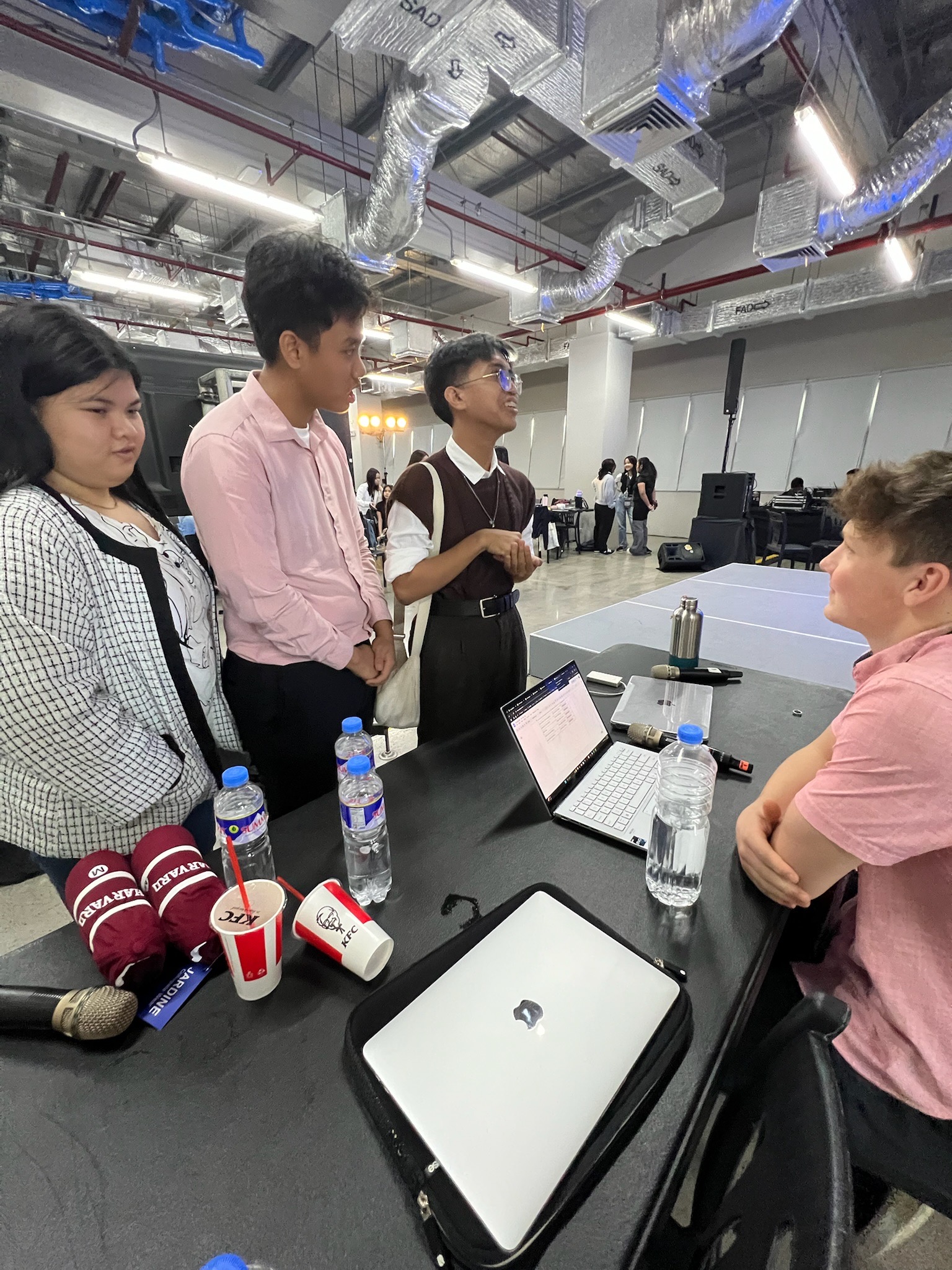 HUGEM members hanging out together with snacks between sessions