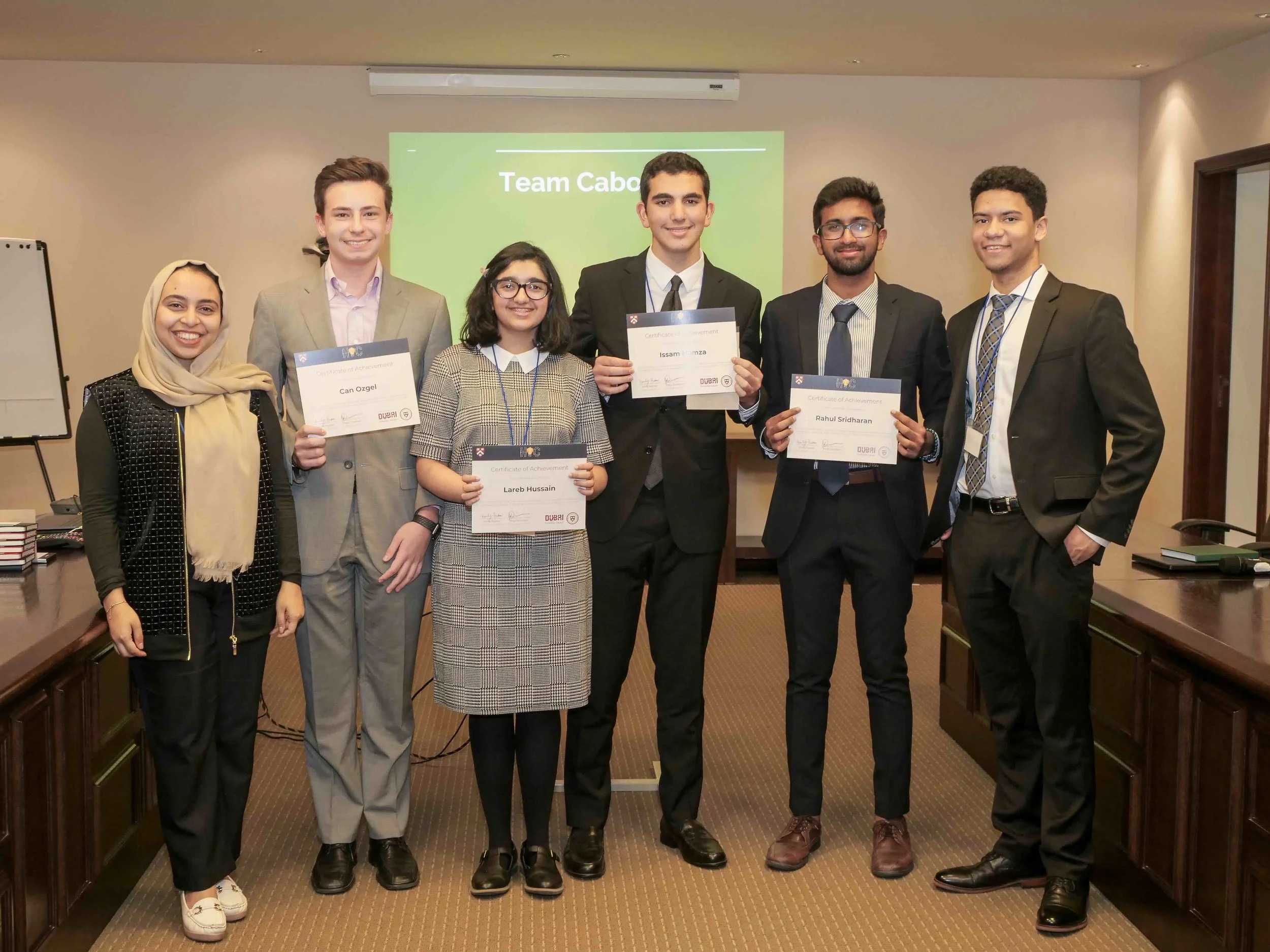Students presenting at a HUGEM conference