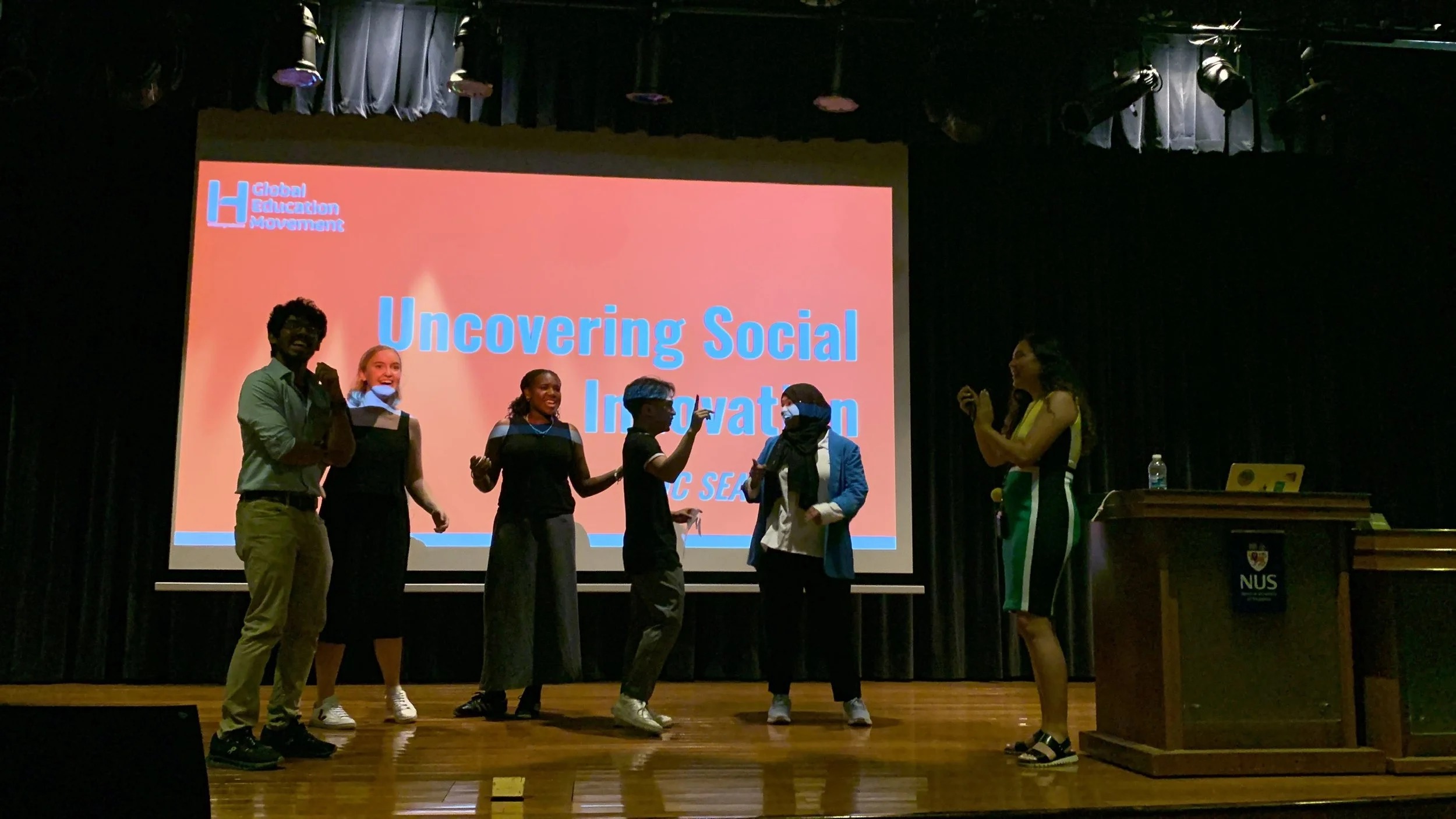 HUGEM students on stage in Singapore